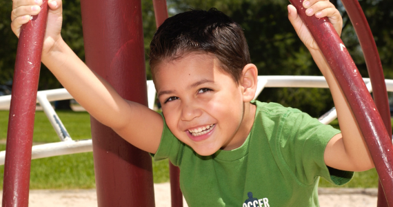 boy laughing at park